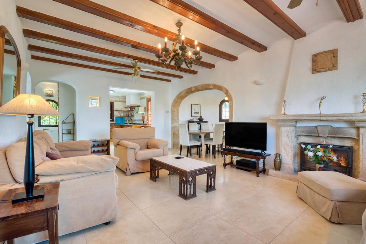 Spacious living room with wooden beams