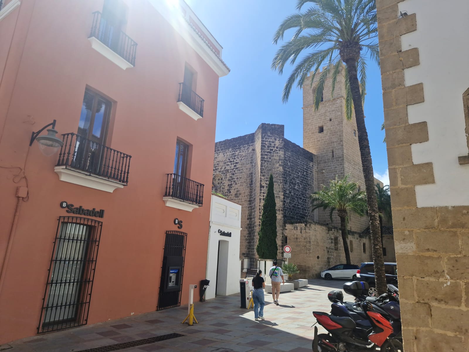 Church tower and palm trees